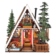 Wooden model of an A-Frame cabin with detailed interior and exterior, surrounded by trees.
