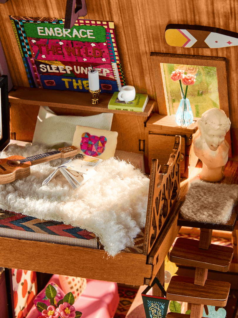 Wooden interior of a small living space with decorative items and furniture.