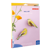 Packaged wall art with yellow birds and flowers on a pink background
