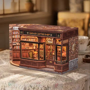 Miniature model of a corner coffee shop on a table with a blurred background