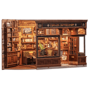 Model of a corner coffee shop with wooden interior and furniture.