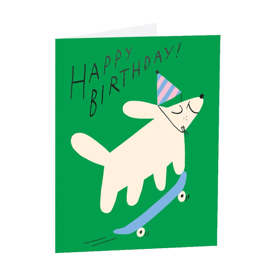 Birthday card with a dog on a skateboard and 'Happy Birthday!' text on a green background