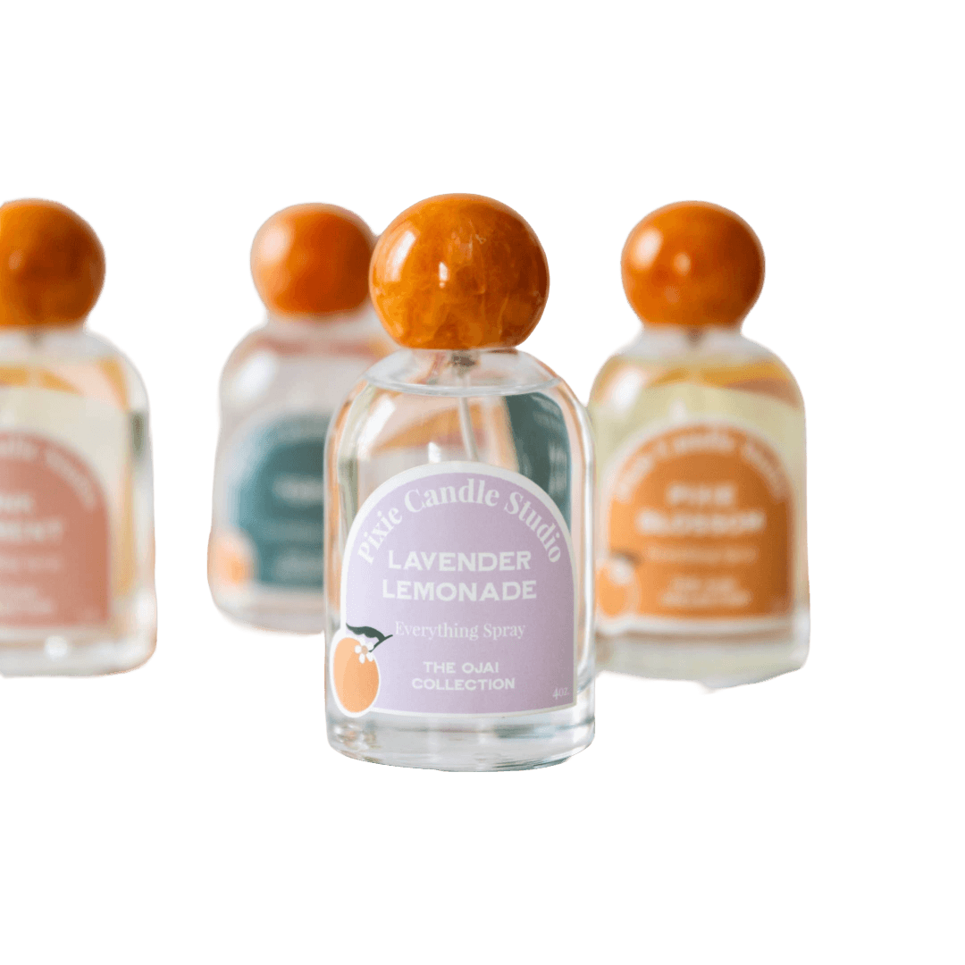 Set of small bottles with orange caps, featuring a 'Lavender Lemonade' bottle in the center.
