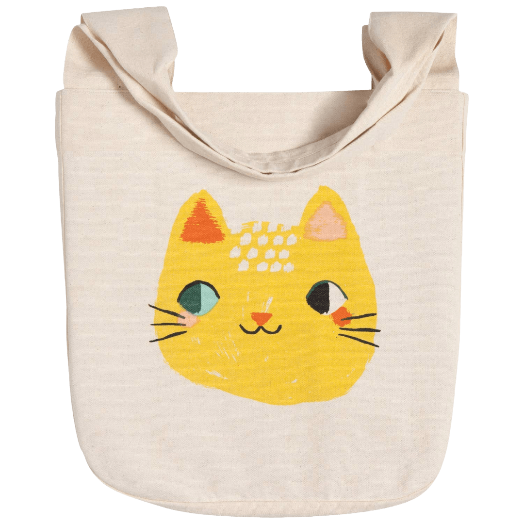 Beige tote bag with a yellow cat face design 