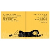 Open book with a person lying on the ground and text on a yellow background