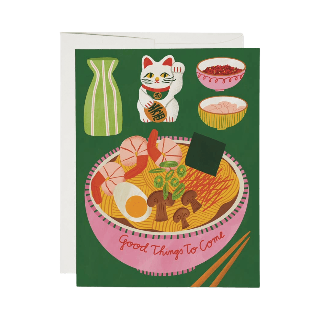 Greeting card with a illustration of a bowl of ramen, chopsticks, and a lucky cat on a green background.