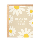 Greeting card with daisy pattern and 'Welcome Little Babe' text on a beige background