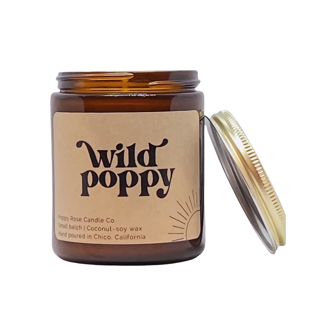 Amber glass candle with 'Wild Poppy' label and gold lid.
