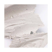 Close-up of clay with visible texture on a white background