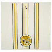 Beige floursack towel with yellow and black stripes and floral design.