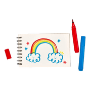 Notebook with a rainbow and cloud drawing, surrounded by markers.