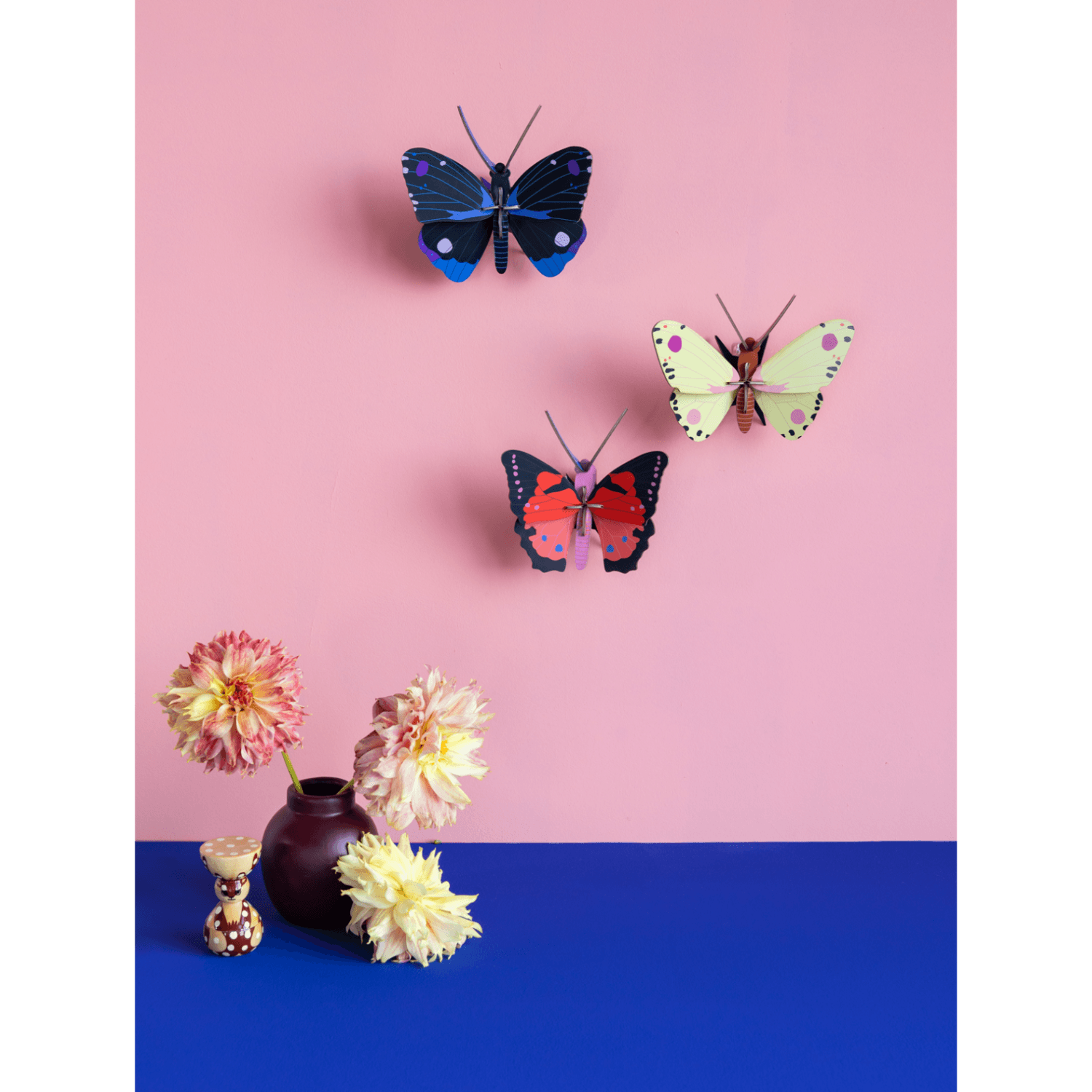 Butterflies and flowers on a pink and blue background
