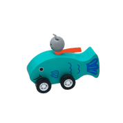 Toy teal fish with a small gray cat figure on top.