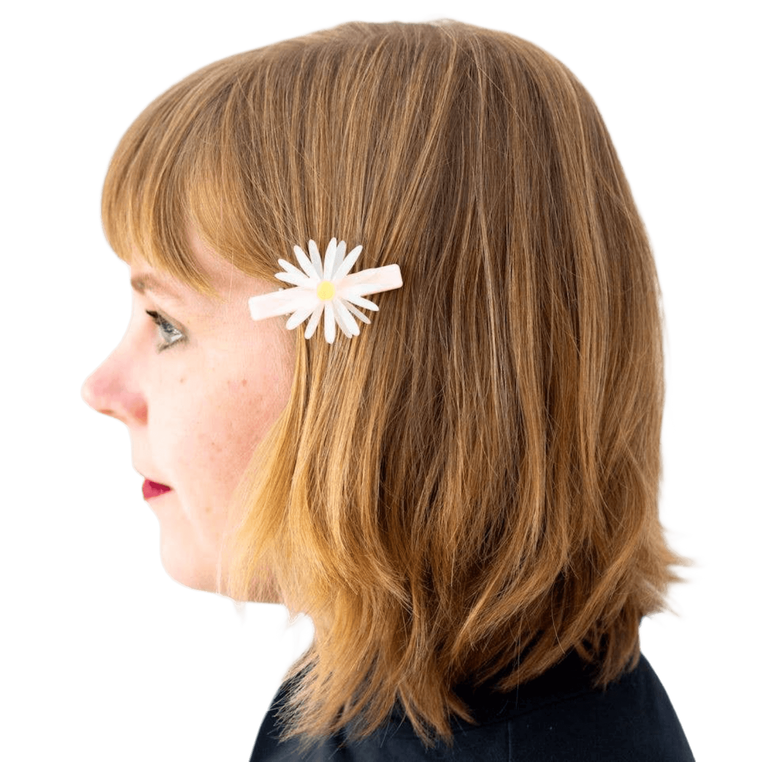 Profile of a person with a white flower hair clip