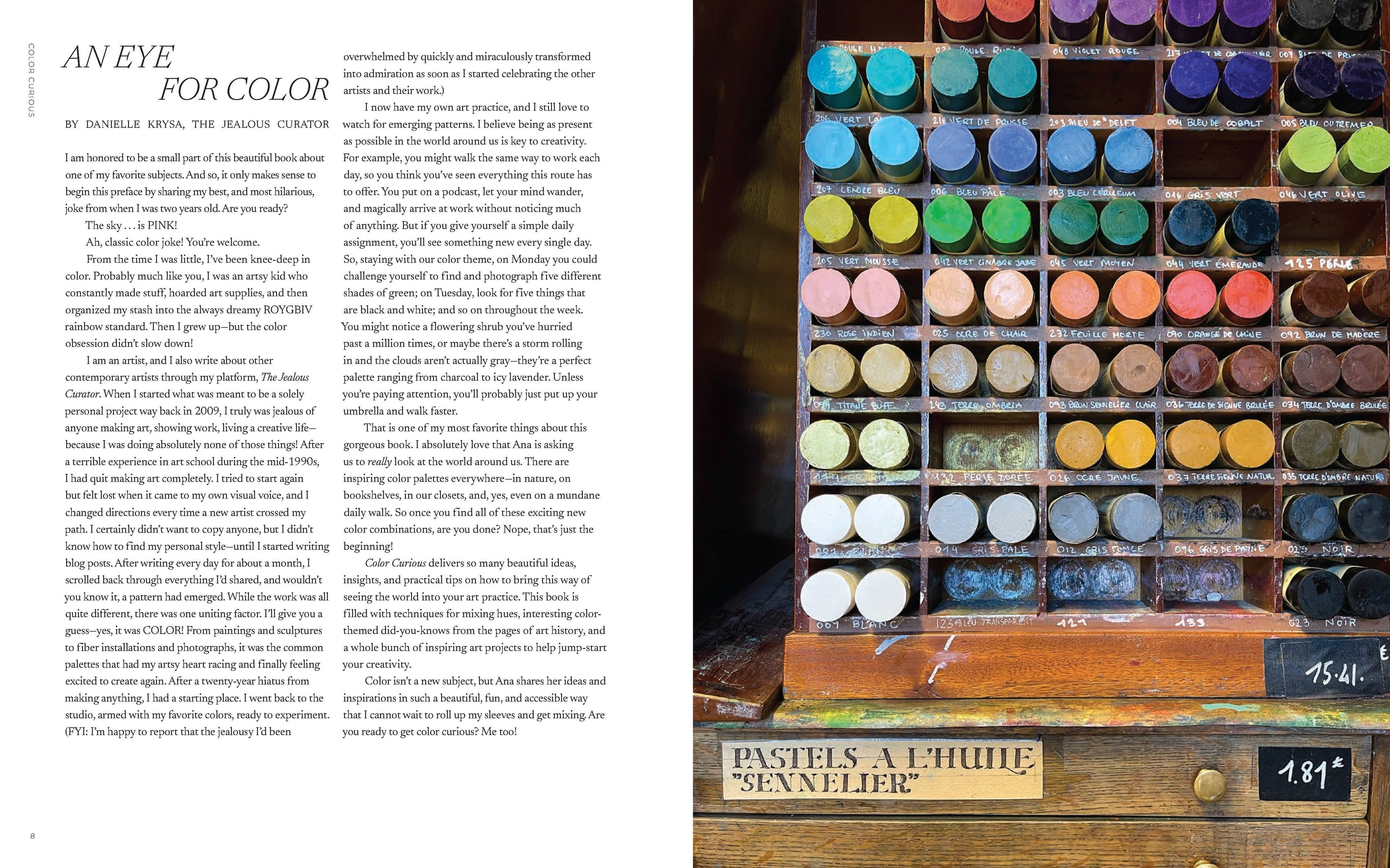 Color swatches in a wooden box with text on a white background
