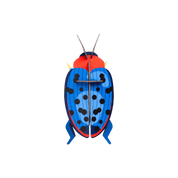 Colorful beetle-shaped paper figurine.