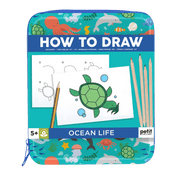 Drawing book titled 'How to Draw Ocean Life' with illustrations and pencils.