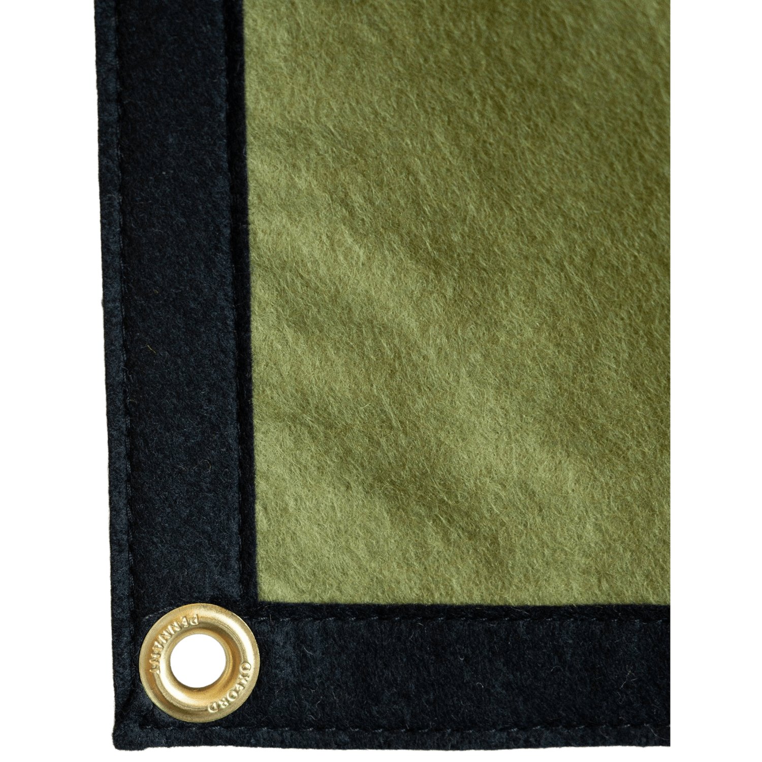 Corner of a green and black banner with a brass eyelet on a white background