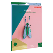 Packaging of a grasshopper wall art with 'studio ROOF' branding on a pink background.