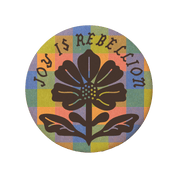 Circular design with a flower and 'Joy is Rebellion' text on a colorful background