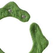 Green fabric bib with snap closures.