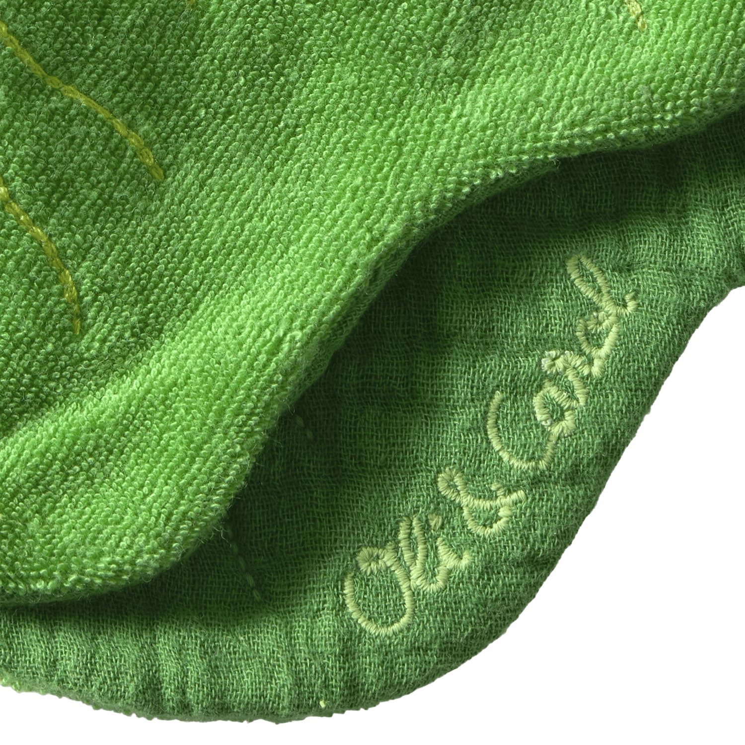 Close-up of green fabric with 'Oli & Carol' branding.