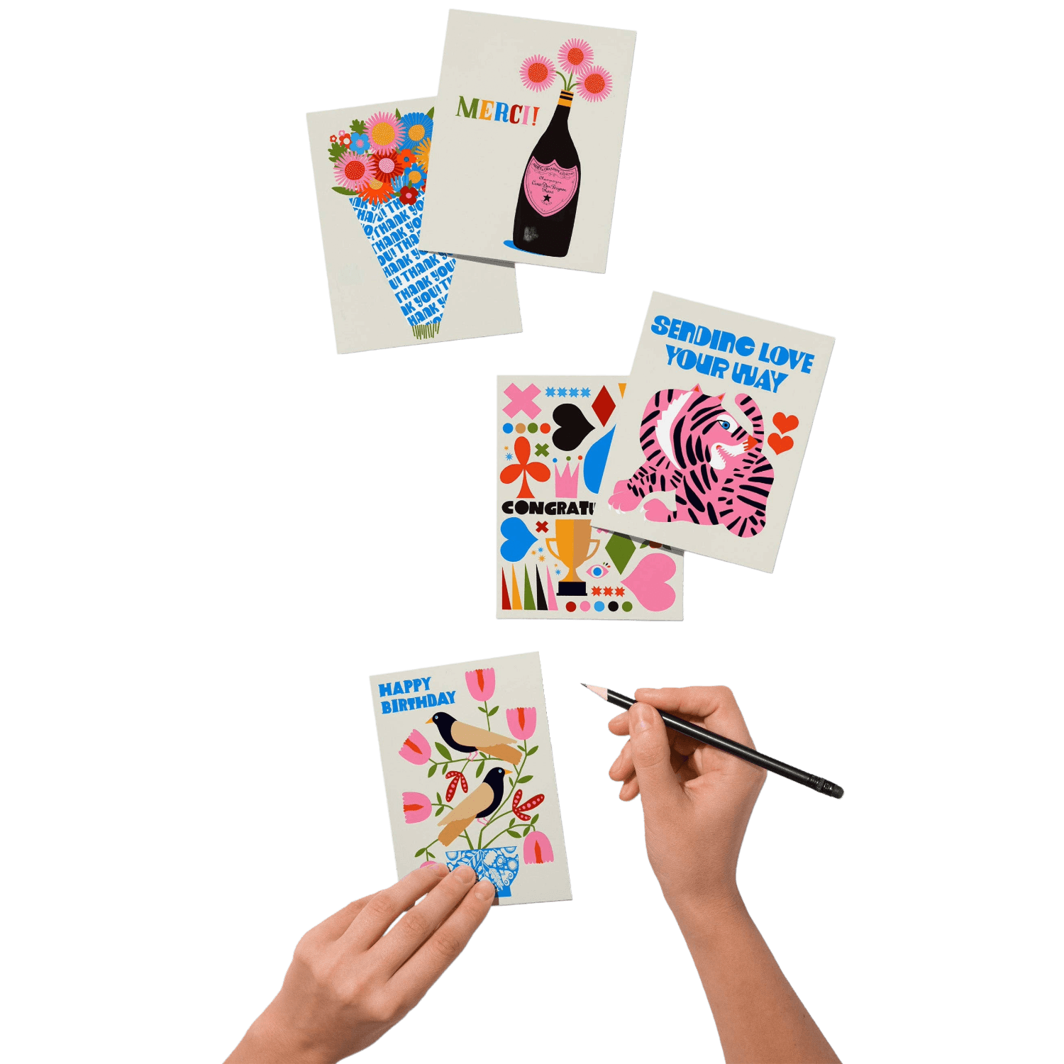 Colorful greeting cards with various designs and hands holding a pen.