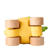 The bottom of a yellow toy lemon with wooden wheels