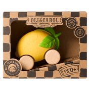 Yellow toy car shaped like a lemon with a green leaf in a cardboard box branded 'Oli & Carol'.