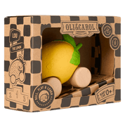 Toy lemon with green stem in a cardboard box branded 'Oli & Carol'.