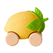 Toy lemon with wooden wheels and green leaf.