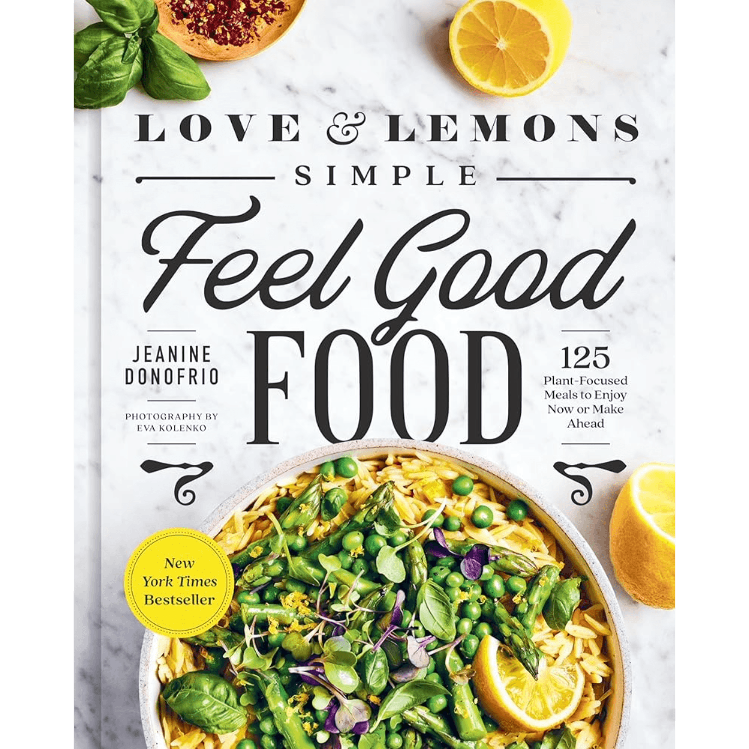 Front cover of the book 'Love & Lemons Simple Feel Good Food' by Jeanine Donfrio, featuring a marble background with lemon slices, basil, and a plated salad of peas, asparagus, and pasta.