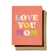 Card with 'Love You Mom' text in colorful letters on a pink background