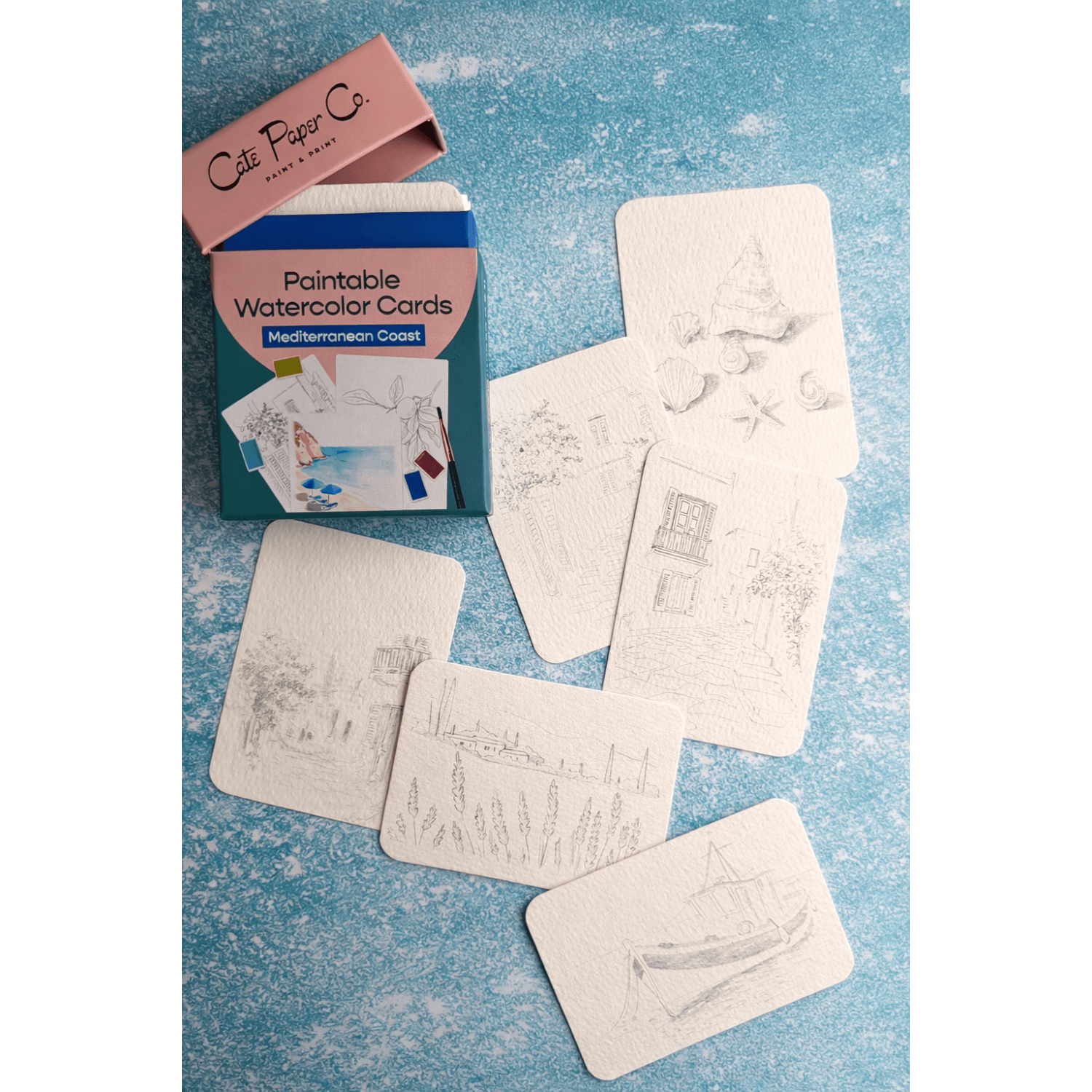 Paintable watercolor cards with a nice box  on a textured blue background