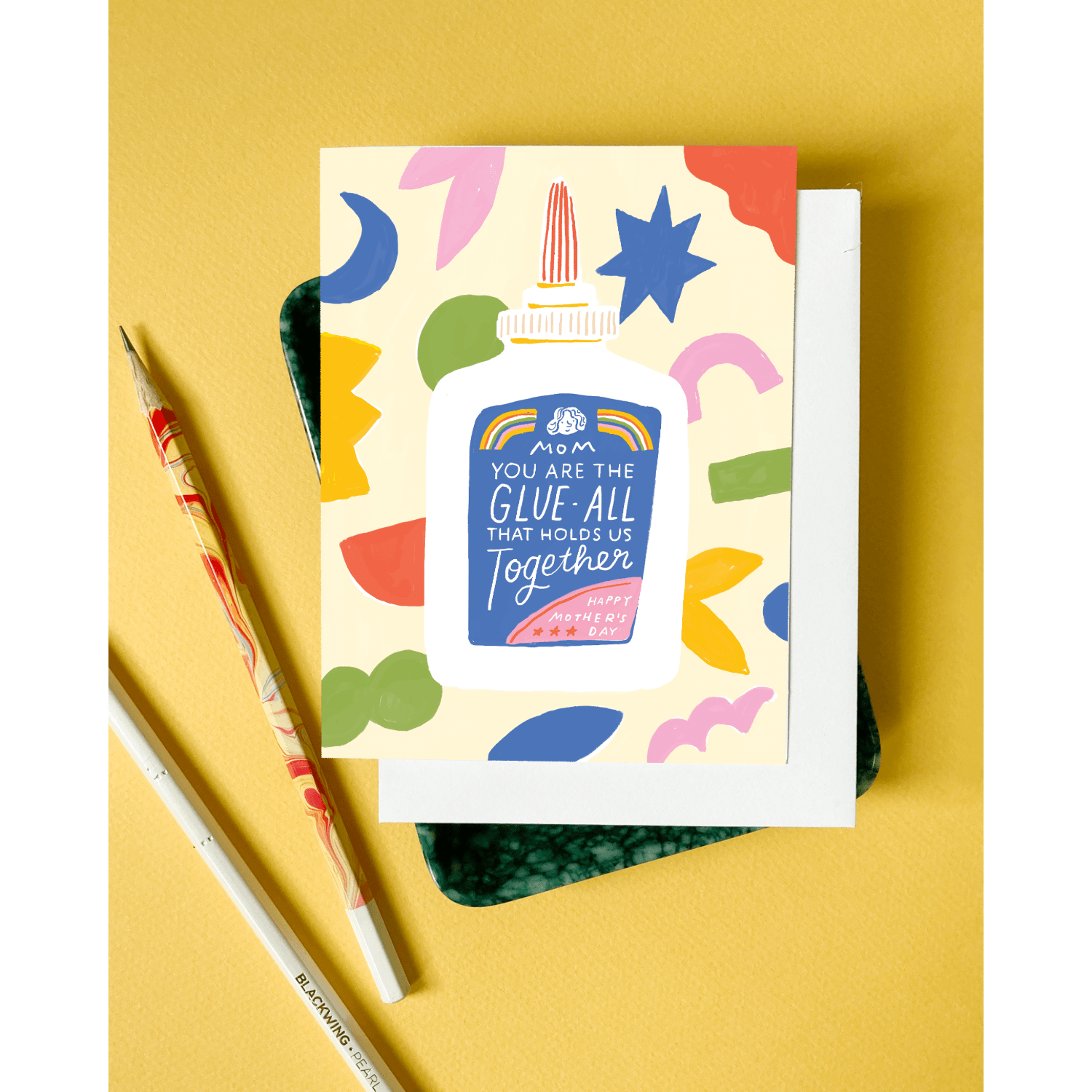 Greeting card with colorful design and text on a yellow background