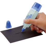 Hand holding a bottle of glue labeled 'Aqua' over a piece of black paper, using the Pen Tip.