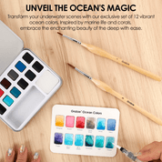 Set of watercolor paints with brushes on a wooden surface, featuring ocean-themed colors.