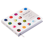 Front and side of a book with colorful dot design on a white background