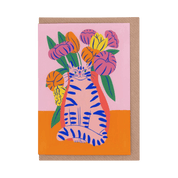 Greeting card with a tiger and floral design on a pink and orange background