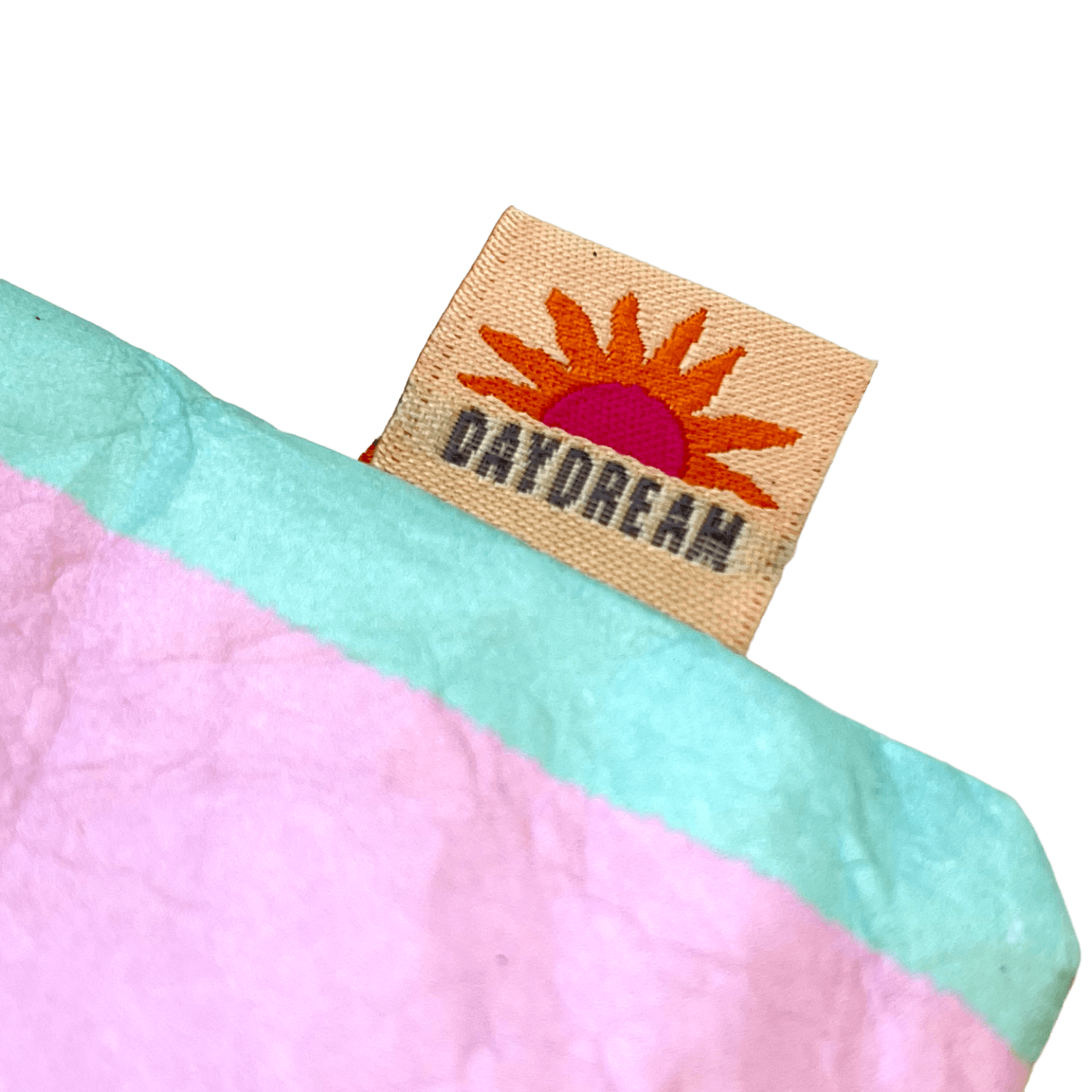 Fabric with a 'Daydream' label featuring a sun design.