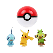 Three small Pokémon character figurines and a large Pokéball floating above them on a plain white background. The characters appear to be a blue Chansey, a yellow Pikachu, and a green Toppo.