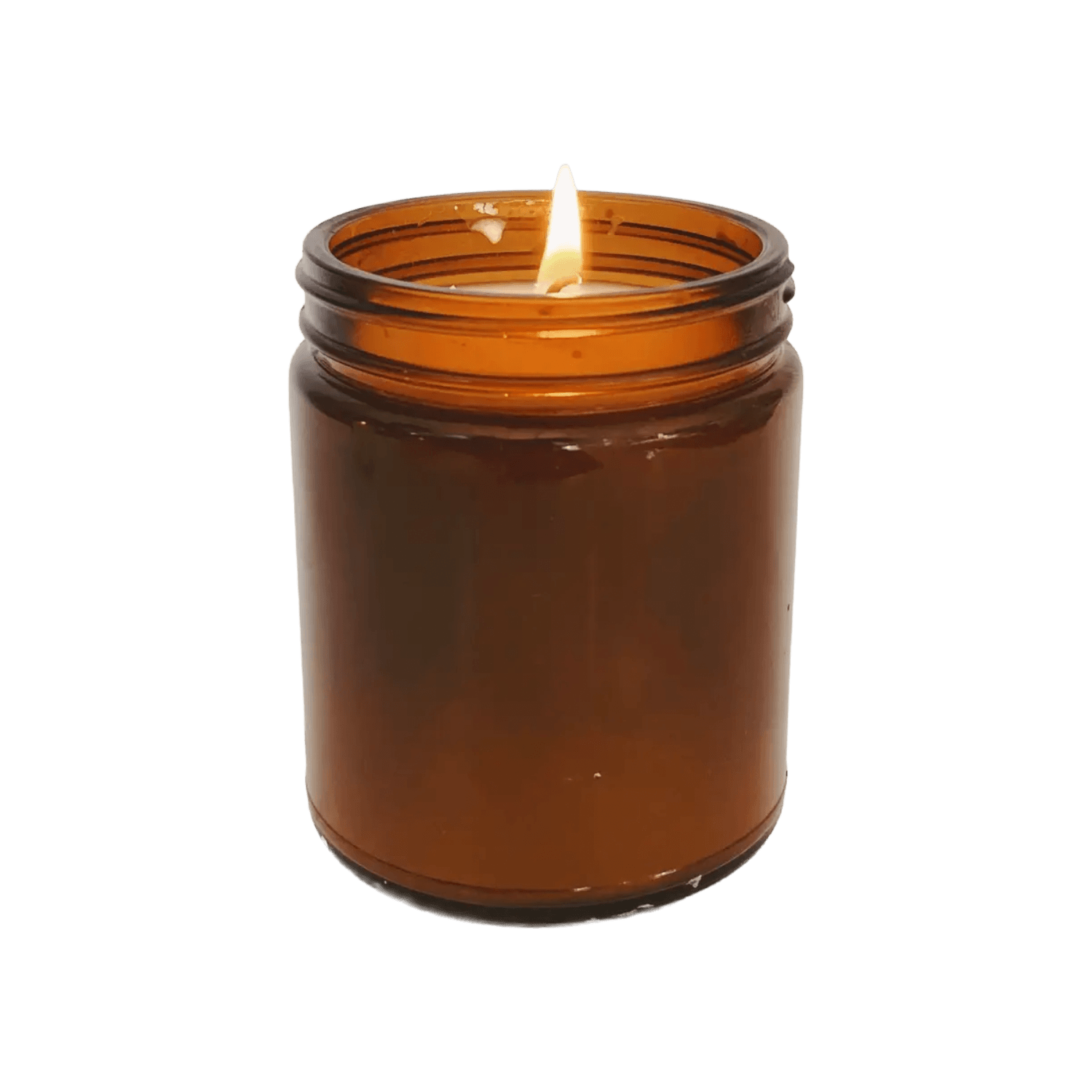 A lit candle in a glass jar.