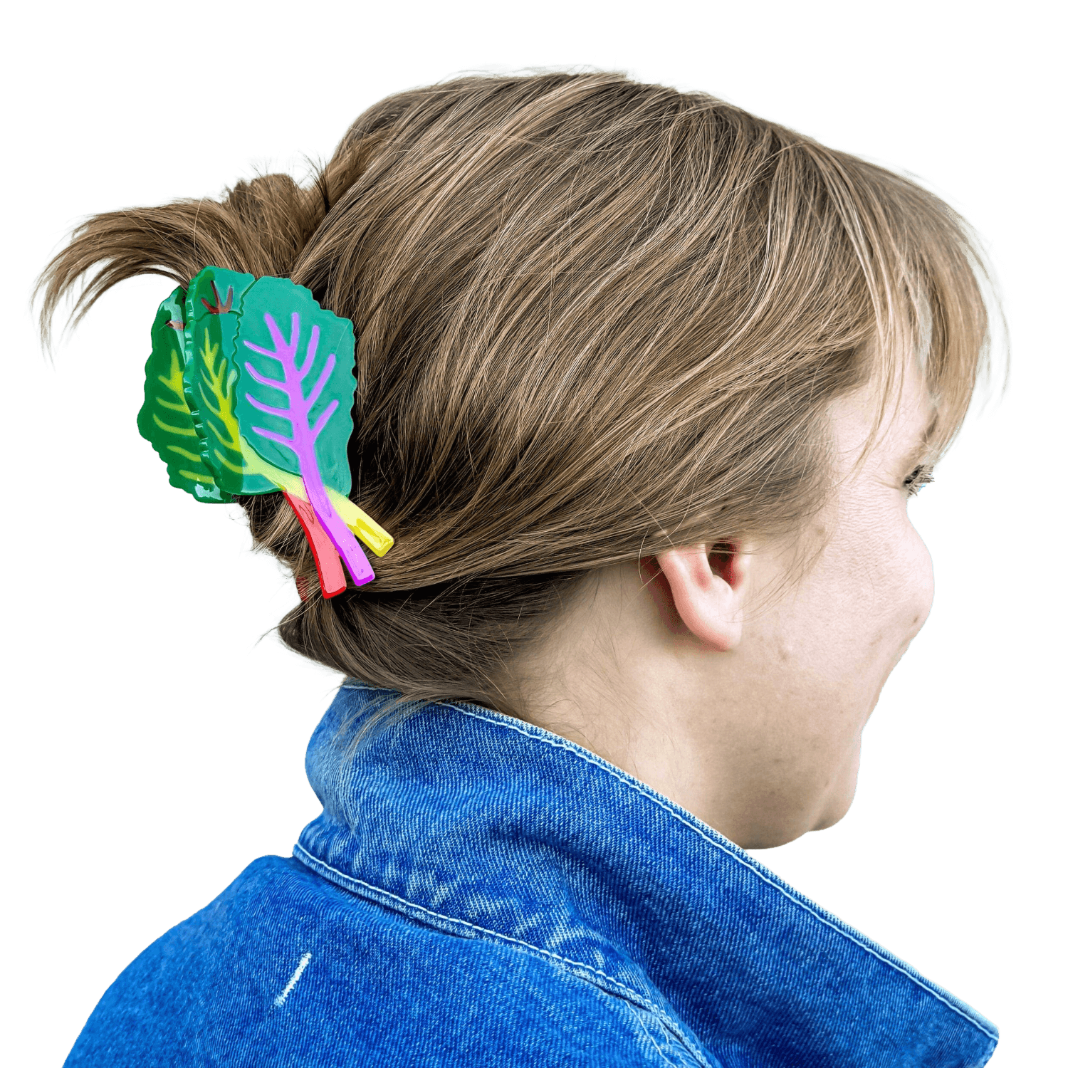 Person wearing a colorful hair clip with leaf design