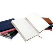 Open notebook with closed notebooks of different colors.