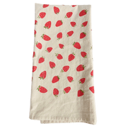 Beige towel with red strawberry pattern.