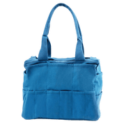 The backside of a blue painter's bag with multiple pockets.