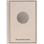 Cream journal with black circular design and 'the good day journal' text