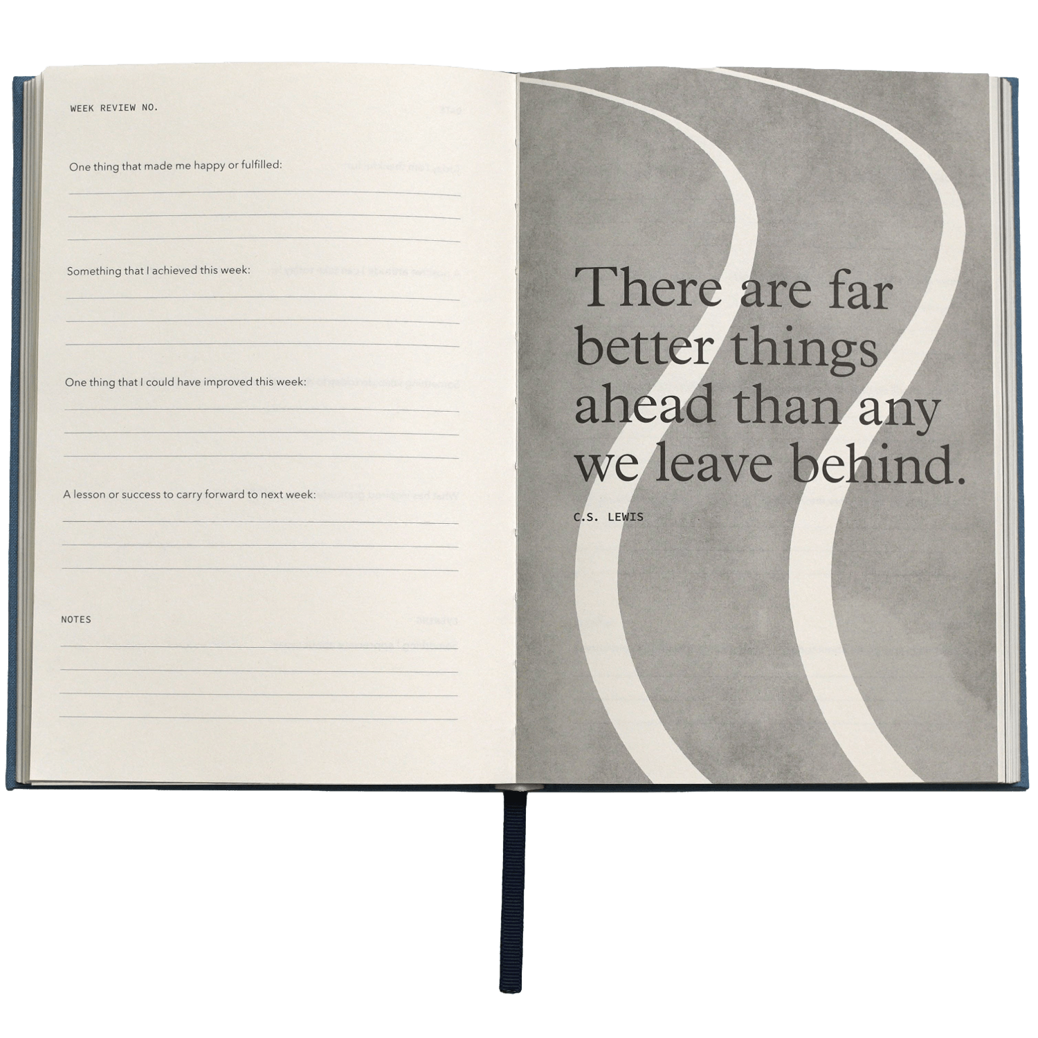 Open notebook with a quote by C.S. Lewis on a gray background
