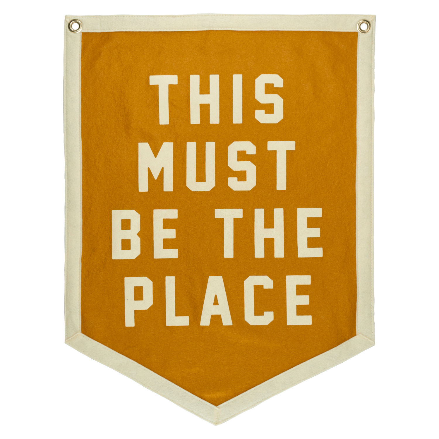 Mustard banner with white text 'THIS MUST BE THE PLACE'