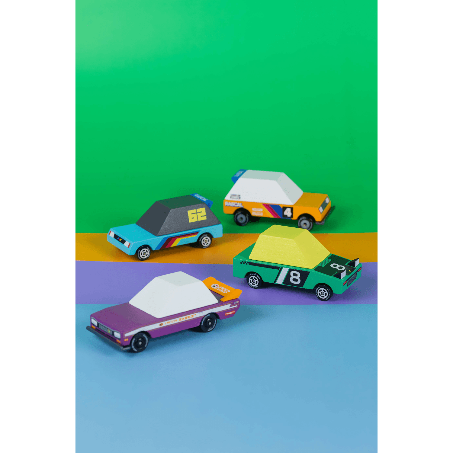 Colorful toy cars on a green, purple, and blue gradient background